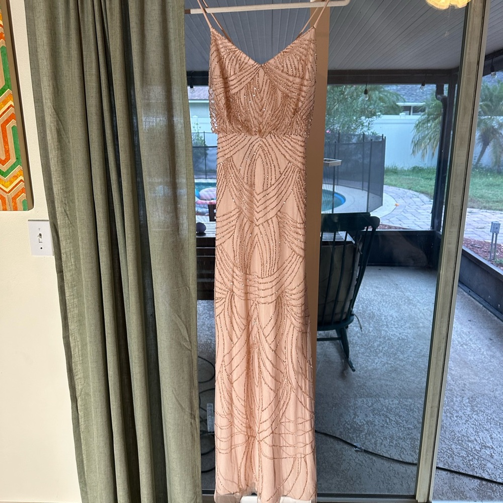 Gorgeous pink dress with beads perfect for a wedding.